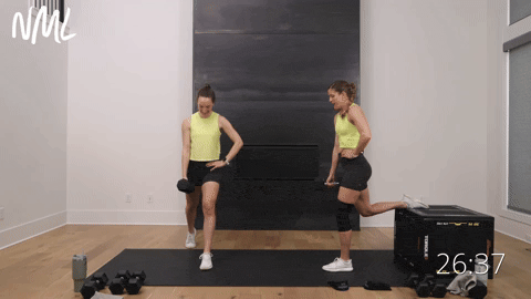 two women performing bulgarian lunges or split lunges with dumbbells in a glutes and quads workout