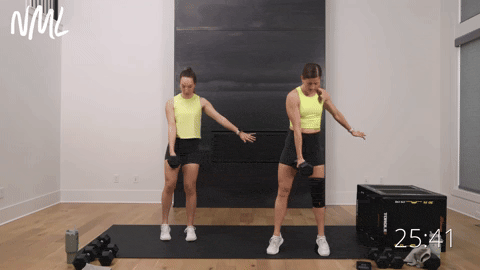 two women performing a curtsy lunge to reverse lunge to curtsy lunge in a glutes and quads workout