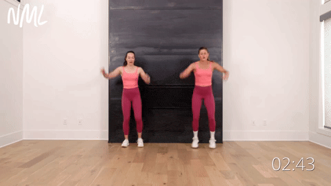 two women performing a step touch forward to back in a step workout at home