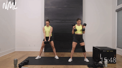 two women performing sumo deadlifts and sumo cleans in a quad and glute workout with dumbbells