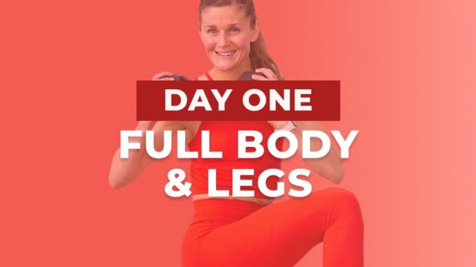woman holding dumbbells as part of full body and leg day workout