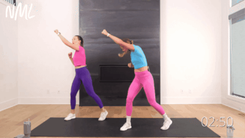 adult women performing a standing crunch and punch