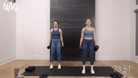 two women performing bicep curl variation as part of arm workout routine