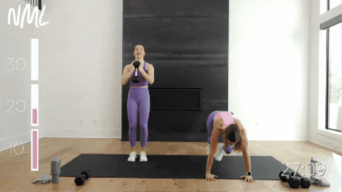 two women performing mountain climbers as part of core circuit 