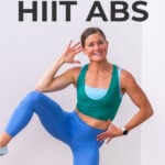woman performing standing crunch as part of quick ab workout