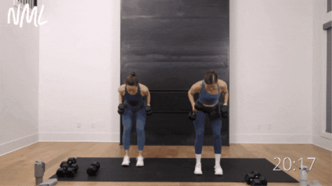 two women performing tricep kickbacks or tricep extensions as part of arm workout routine